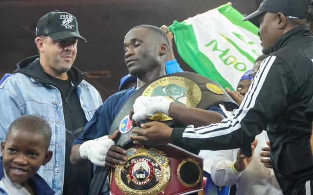 WINDHOEK, 09 May 2026 – Namibia’s World Boxing Organisation (WBO) Global Super Bantamweight champion, Fillipus Nghitumbwa (centre), receving his belt from Deputy Minister of Sport, Dino Balloti after his win against Colombia’s Leonardo Carrillo in Windhoek. Nghitumbaw successfully retained his title after an impressive performance. (Photo by: Hesron Kapanga) NAMPA