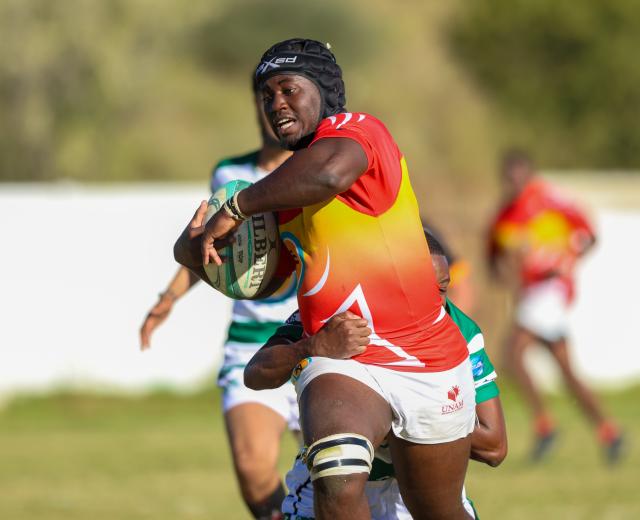 WINDHOEK, 09 May 2026 - UNAM Rugby Club player (in red and yellow) while in action against Western Suburbs during round four of the Namibia Rugby Union Premier League at the Western Suburbs Park in Khomasdal. UNAM won the match 28-07. (Photo by: Hesron Kapanga) NAMPA
