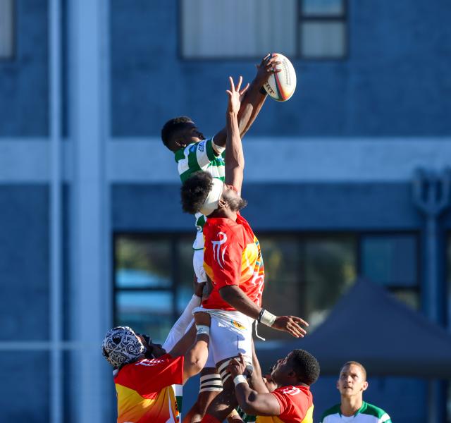 WINDHOEK, 09 May 2026 - UNAM Rugby Club player (in red and yellow) while in action against Western Suburbs during round four of the Namibia Rugby Union Premier League at the Western Suburbs Park in Khomasdal. UNAM won the match 28-07. (Photo by: Hesron Kapanga) NAMPA