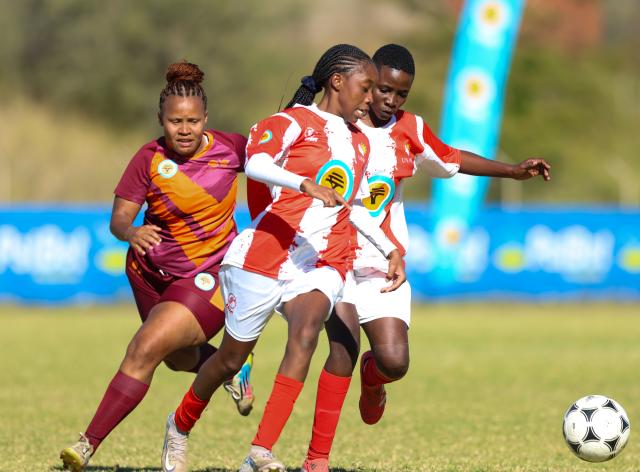 WINDHOEK, 16 May 2026 - A UNAM Bokkies player (in red and white) battles for possession against Ongos FC (in maroon) during Round 20 of the Women’s Super League at UNAM Stadium in Windhoek. The closely contested encounter ended in a goalless draw. (Photo by: Hesron Kapanga) NAMPA
