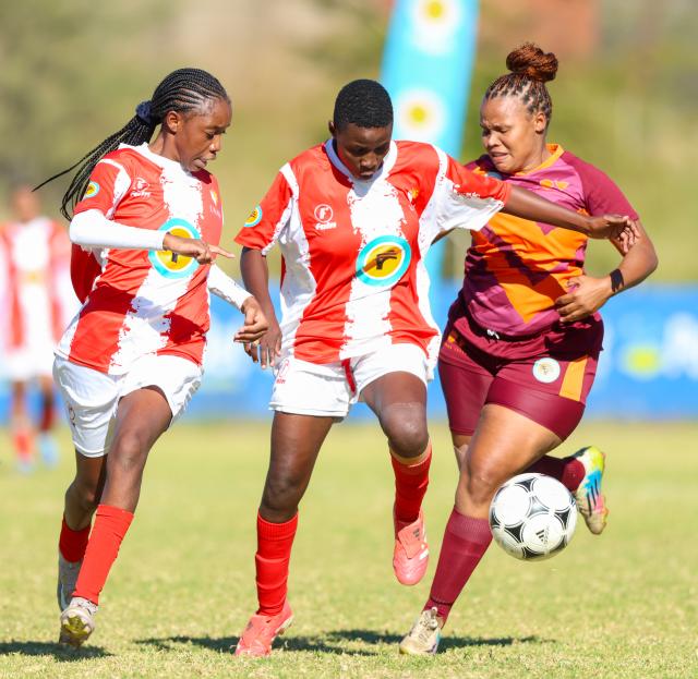 WINDHOEK, 16 May 2026 - A UNAM Bokkies player (in red and white) battles for possession against Ongos FC (in maroon) during Round 20 of the Women’s Super League at UNAM Stadium in Windhoek. The closely contested encounter ended in a goalless draw. (Photo by: Hesron Kapanga) NAMPA