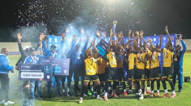 WINDHOEK, 24 May 2024 - Military outfit Mighty Gunners celebrating their firstever Standard Bank Top 8 title which they secured after a thrilling 2-1 victory over UNAM FC at the Independence Stadium. (Photo by: Hesron Kapanga) NAMPA