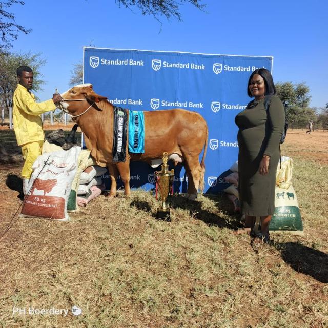 ORUHARUI, 01 June 2026- Event organiser Florence Handura is pictured with the livestock handler of the cow Sylvia, which was named Champion Cow, during the Oruharui SME Agricultural Expo 2026. ( Photo: Contributed) NAMPA 