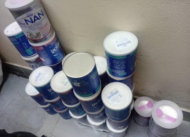 OTJIWARONGO, 19 June 2026 - Tins of baby formula milk allegedly stolen from the Otjiwarongo State Hospital and found in a tuckshop at  Orwetoveni location on Friday. The milk tins were allegedly placed on shelves for display and sale to the general public by a 40-year-old male Congolese national. (Photo contributed) NAMPA 
