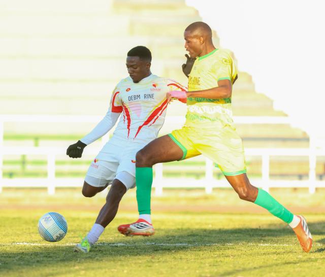WINDHOEK, 20 June 2026 - Okahandja United, Josef Lumbu (yellow) while in action against UNAM FC, Paulus Amutenya at the Independence Stadium during the semi-final clash of the Namibia Football Association Cup. UNAM FC won the match 1-0. (Photo by: Hesron Kapanga) NAMPA