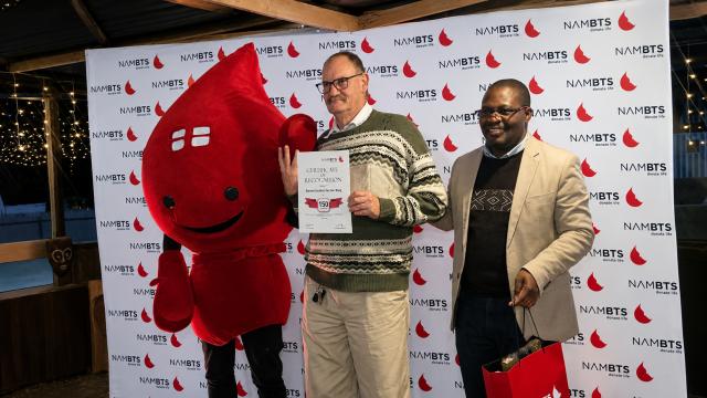 SWAKOPMUND, 25 June 2026 - Barnes Jacobs Van Der Berg receives the 150th Blood Donation Milestone Award from Chief Exective Officer Israel Chipare during the Namibia Blood Transfusion Service (NAMBTS) Erongo Donor Awards ceremony that took place in Swakopmund. He was one of the many donors awarded for their contributions this evening. (Photo by: Isabel Bento) NAMPA
