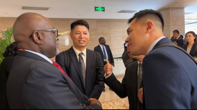 BEIJING, 09 JUL (NAMPA) - Industries, Mines and Energy Minister Modestus Amutse engaging Simomine Tsumeb smelter Mine Logan Lou Lou Yonggang during the Namibia-China business fair in Beijing. (Photo by : Isabel Bento) NAMPA