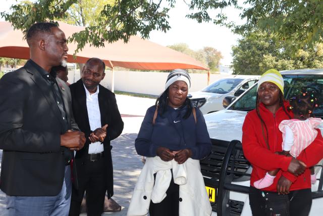 OSHAKATI, 14 July 2026 - (From right) Wilpartina Namukanda and her 11-months baby, Monika Amwele, Uuvidhiya constituency councilor Timoteus Shivute and Oshana Regional governor Hofni Iipinge during the arrival of some Namibians who have been repatriated from South Africa at the regional Council on Monday. (photo:Ester Hakaala) NAMPA