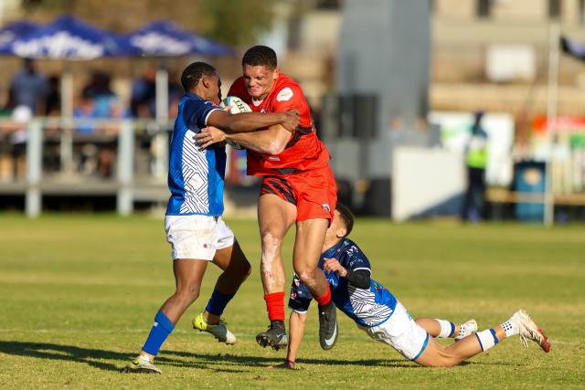 WINDHOEK, 18 July 2026 - Rehoboth rugby club players in red while in action against Trustco United (in blue) during round eight of the Namibia Rugby Union Premier League at the Trustco United field in Olympia. (Photo by: Hesron Kapanga) NAMPA 