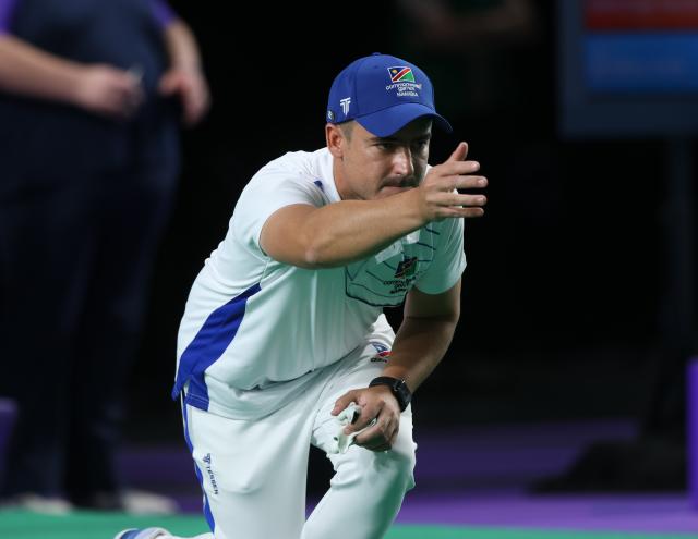 GLASGOW, 23 July 2026 - Waylon Wentzel of Team Namibia bowling during the mens single's match on the opening day of the Glasgow 2026 Commonwealth Games. (Photo by: Hesron Kapanga) NAMPA