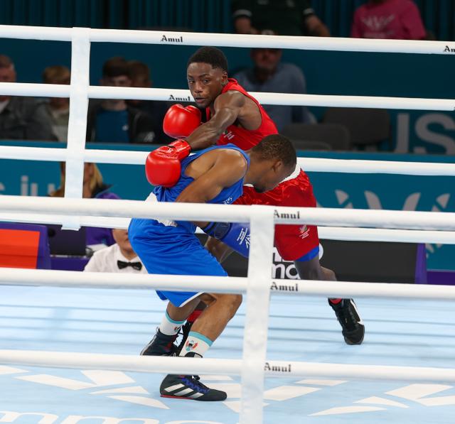 GLASGOW, 24 July 2026 – Namibia's 55kg boxer, Philip Mutakela Haoseb (in red), while in action against Eswatini's Siboniso Charles Vilakati in the round of 32 at the 2026 Commonwealth Games in Glasgow, Scotland. The 21-year-old, Namibian made his Commonwealth Games debut, and delivered a commanding performance to defeat his opponent with a unanimous 5-0 decision from the judges. (Photo: Hesron Kapanga) NAMPA