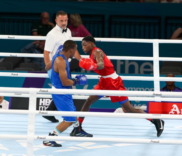 GLASGOW, 24 July 2026 – Namibia's 55kg boxer, Philip Mutakela Haoseb (in red), while in action against Eswatini's Siboniso Charles Vilakati in the round of 32 at the 2026 Commonwealth Games in Glasgow, Scotland. The 21-year-old, Namibian made his Commonwealth Games debut, and delivered a commanding performance to defeat his opponent with a unanimous 5-0 decision from the judges. (Photo: Hesron Kapanga) NAMPA