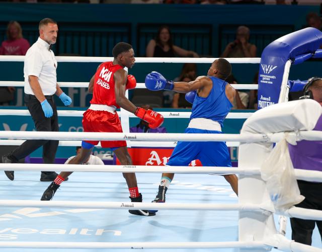 GLASGOW, 24 July 2026 – Namibia's 55kg boxer, Philip Mutakela Haoseb (in red), while in action against Eswatini's Siboniso Charles Vilakati in the round of 32 at the 2026 Commonwealth Games in Glasgow, Scotland. The 21-year-old, Namibian made his Commonwealth Games debut, and delivered a commanding performance to defeat his opponent with a unanimous 5-0 decision from the judges. (Photo: Hesron Kapanga) NAMPA