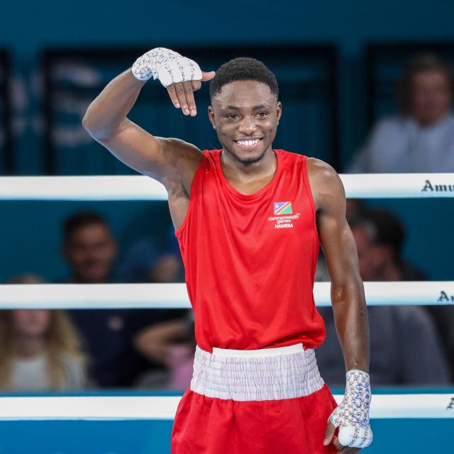 GLASGOW, 26 July 2026 - Philip Pumulo Mutakela Haoseb (in red) celebrating after his win against Charif Yaya of Togo during Round of 16 bouts at the Commonwealth Games in Glasgow, Scotland. Haoseb secured victory with a second-round knockout to advance to the quarter-finals. (Photo: Hesron Kapanga) NAMPA
