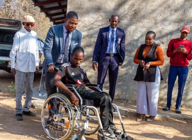 MPUNGU, 27 July 2026 - Joseph Abaseb, 41, of Farm Huigub, who fixes fences to survive and never went to school because of his disability, receives a wheelchair from the Office of the Vice President. (Photo by: Lylie Joel) NAMPA