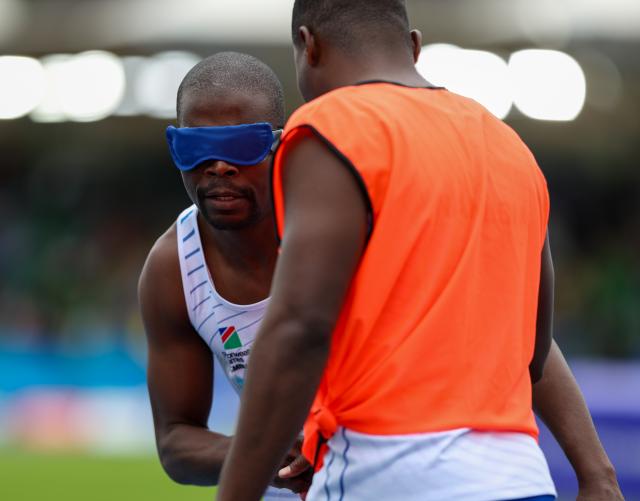 GLASGOW, 29 July 2026 – Namibia’s para-sprinter Ananias Shikongo, and his guide Even Tjuiju after crossing the finish line of the T11/12 100 metres heats at the Commonwealth Games in Glasgow, Scotland. (Photo: Hesron Kapanga) NAMPA