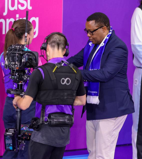 GLASGOW, 25 July 2026 - Namibia National Olympic Committee (NNOC) president Ndeulipula Hamutumwa while presenting medals to the winning swimmers at Tollcross Swimming Centre in Glasgow, Scotland during the Glasgow 2026 Commonwealth Games. (Photo by: Hesron Kapanga) NAMPA