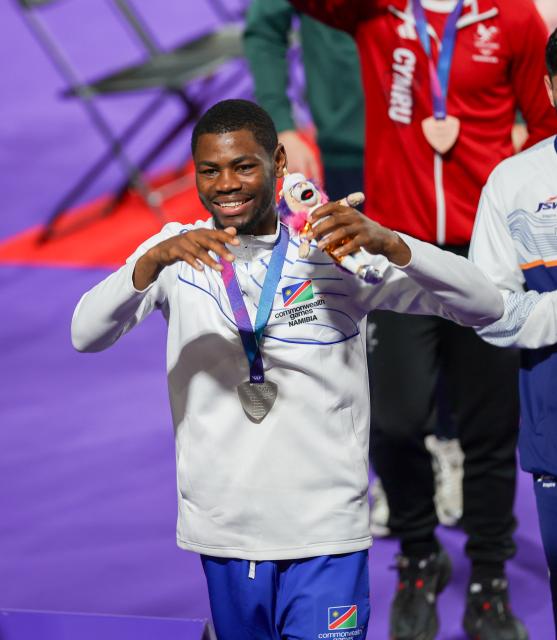 GLASGOW, 01 August  2026 – Namibia’s boxer Tryagain Morning Ndevelo celebrating after receiving his silver medal during the medal award ceremony of the 60kg at the Commonwealth Games in Glasgow, Scotland. (Photo: Hesron Kapanga) NAMPA