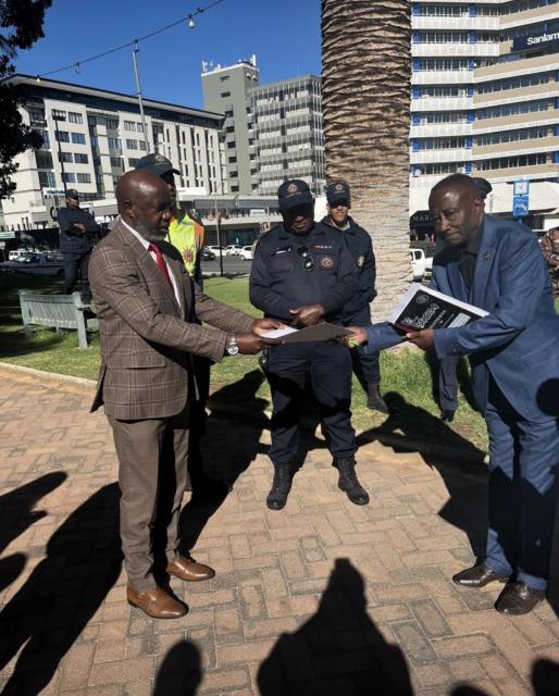 Windhoek, 10 August 2026- Justice ministry Executive Director Audrin Mathe receiving a petition from Matheus Nangolo. (photo contributed). NAMPA
