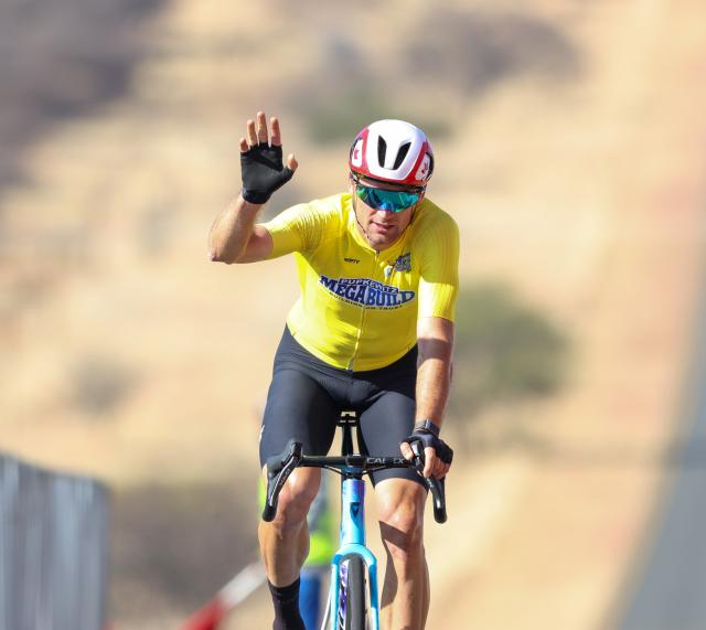 WINDHOEK, 21 August 2026 - Namibia’s international rider Alex Miller while crossing the line in during stage two of the 2026 Pupkewitz Megabuild Tour de Windhoek on the Dordabis Road. Miller won the stage with a huge margin from the peloton. (Photo: Hesron Kapanga) NAMPA