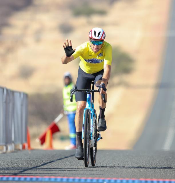 WINDHOEK, 21 August 2026 - Namibia’s international rider Alex Miller while crossing the line in during stage two of the 2026 Pupkewitz Megabuild Tour de Windhoek on the Dordabis Road. Miller won the stage with a huge margin from the peloton. (Photo: Hesron Kapanga) NAMPA
