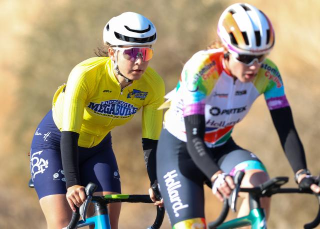 WINDHOEK, 21 August 2026 - South African rider Lize-Ann Louw (in yellow) while in action aganist Anri Greef (front) during stage two of the 2026 Pupkewitz Megabuild Tour de Windhoek on the Dordabis Road. (Photo: Hesron Kapanga) NAMPA