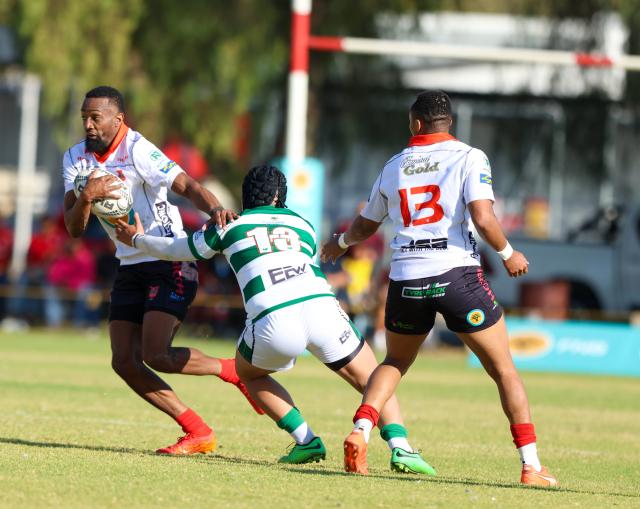 WINDHOEK, 15 August 2026 - Wanderers flyhalf Nandivatu Karuuombe (with a ball in white) while in action against Western Suburbs centre Jonathan Kamfer during Round 11 of the Namibia Rugby Union Premier League at the Wanderers Sports Ground in Pionerspark. Wanderers won the match 104-18. (Photo by: Hesron Kapanga) NAMPA 
