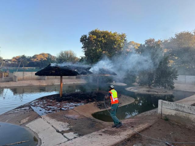 OTJIWARONGO, 17 August 2026 - The Otjiwarongo municipality firefighting team headed by chief Daniel Pavaza extinguishes fire at the crocodile farm's thatch rooftop which accidentally caught fire on Monday afternoon at Otjiwarongo. (Photo by: Mulisa Simiyasa) NAMPA