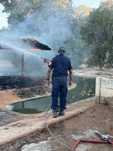 OTJIWARONGO, 17 August 2026 - The Otjiwarongo municipality firefighting team headed by chief Daniel Pavaza extinguishes fire at the crocodile farm's thatch rooftop which accidentally caught fire on Monday afternoon at Otjiwarongo. (Photo by: Mulisa Simiyasa) NAMPA