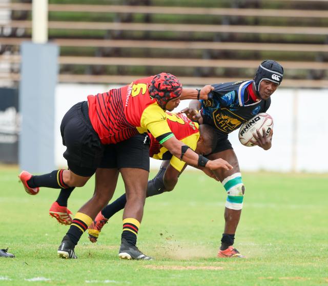 WINDHOEK, 12 September 2026 - Oceans and Oranjemund Rugby Clubs players (in blue/black and orange and red) while in action during the second semifinals of the Namibia Rugby Union (NRU) First Division championship trophy at the Hage Geingob Stadium. Oranjemund won the match 26-19 to qualify for the final against Vipers. (Photo by: Hesron Kapanga) NAMPA
