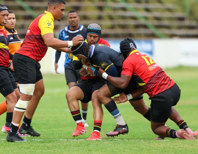 WINDHOEK, 12 September 2026 - Oceans and Oranjemund Rugby Clubs players (in blue/black and orange and red) while in action during the second semifinals of the Namibia Rugby Union (NRU) First Division championship trophy at the Hage Geingob Stadium. Oranjemund won the match 26-19 to qualify for the final against Vipers. (Photo by: Hesron Kapanga) NAMPA
