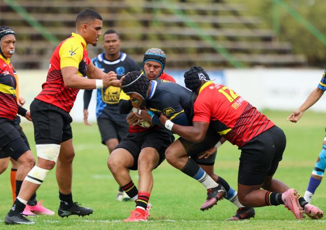 WINDHOEK, 12 September 2026 - Oceans and Oranjemund Rugby Clubs players (in blue/black and orange and red) while in action during the second semifinals of the Namibia Rugby Union (NRU) First Division championship trophy at the Hage Geingob Stadium. Oranjemund won the match 26-19 to qualify for the final against Vipers. (Photo by: Hesron Kapanga) NAMPA
