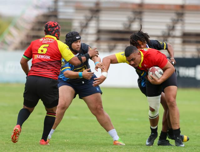 WINDHOEK, 12 September 2026 - Oceans and Oranjemund Rugby Clubs players (in blue/black and orange and red) while in action during the second semifinals of the Namibia Rugby Union (NRU) First Division championship trophy at the Hage Geingob Stadium. Oranjemund won the match 26-19 to qualify for the final against Vipers. (Photo by: Hesron Kapanga) NAMPA
