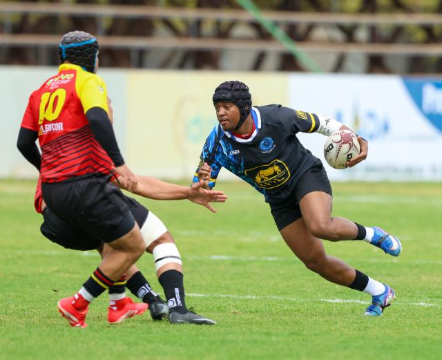 WINDHOEK, 12 September 2026 - Oceans and Oranjemund Rugby Clubs players (in blue/black and orange and red) while in action during the second semifinals of the Namibia Rugby Union (NRU) First Division championship trophy at the Hage Geingob Stadium. Oranjemund won the match 26-19 to qualify for the final against Vipers. (Photo by: Hesron Kapanga) NAMPA
