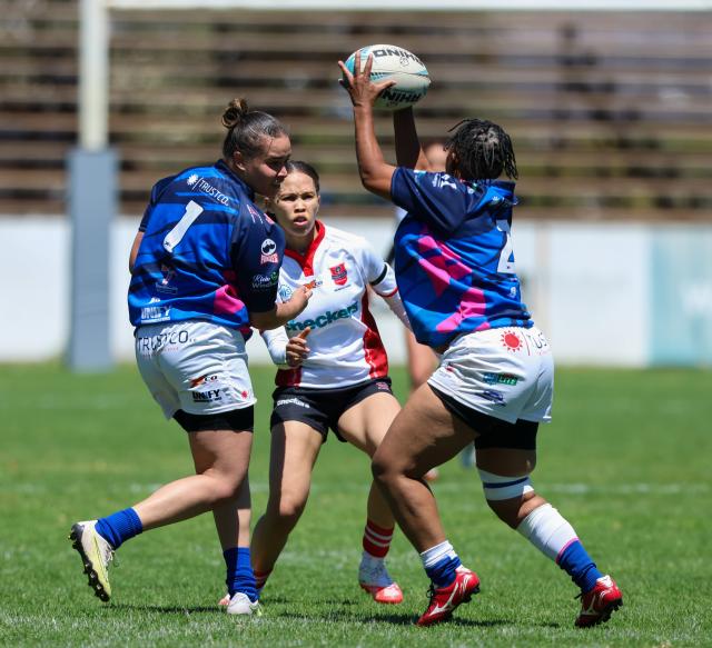 WINDHOEK, 19 September 2026 - Wanderers Women’s Rugby (in white) players while in action against Montego United (blue and white) during the Women’s 15s Rugby League at Hage Geingob Stadium in Olympia on Saturday. Wanderers won the match 24-19. (Photo: Hesron Kapanga) NAMPA
