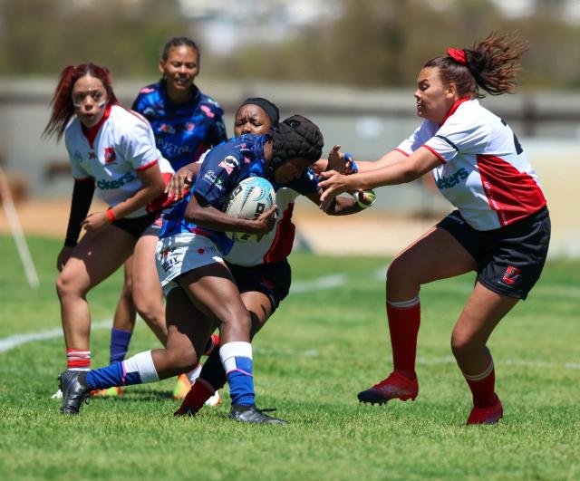 WINDHOEK, 19 September 2026 - Wanderers Women’s Rugby (in white) players while in action against Montego United (blue and white) during the Women’s 15s Rugby League at Hage Geingob Stadium in Olympia on Saturday. Wanderers won the match 24-19. (Photo: Hesron Kapanga) NAMPA
