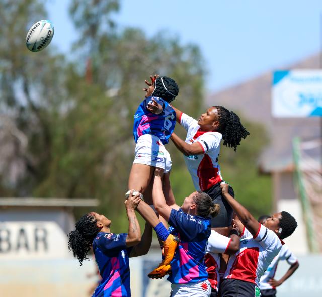 WINDHOEK, 19 September 2026 - Wanderers Women’s Rugby (in white) players while in action against Montego United (blue and white) during the Women’s 15s Rugby League at Hage Geingob Stadium in Olympia on Saturday. Wanderers won the match 24-19. (Photo: Hesron Kapanga) NAMPA
