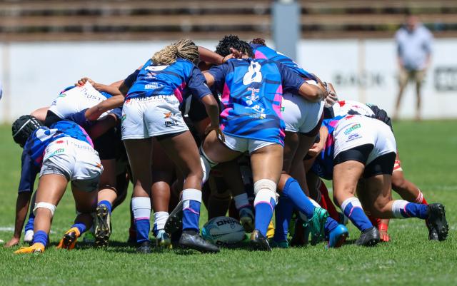 WINDHOEK, 19 September 2026 - Wanderers Women’s Rugby (in white) players while in action against Montego United (blue and white) during the Women’s 15s Rugby League at Hage Geingob Stadium in Olympia on Saturday. Wanderers won the match 24-19. (Photo: Hesron Kapanga) NAMPA
