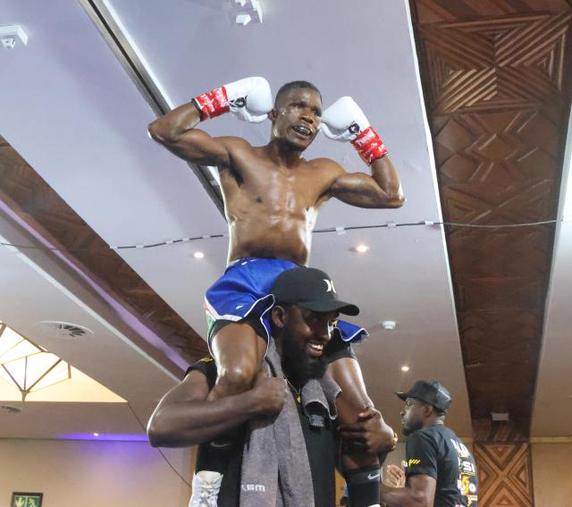 WINDHOEK, 20 September 2026 – Namibia’s World Boxing Organisation (WBO) Global flyweight champion Fillemon Nghutenanye while celebrating with his training after defeating Berland Robles of the Philippines at the Windhoek Country Club and Resort during the Salute Boxing Promotions’ Building of Champions: Battle for Greatness Boxing Bonanza. Nghutenanye securing a fifth-round technical knockout victory. (Photo: Hesron Kapanga) NAMPA
