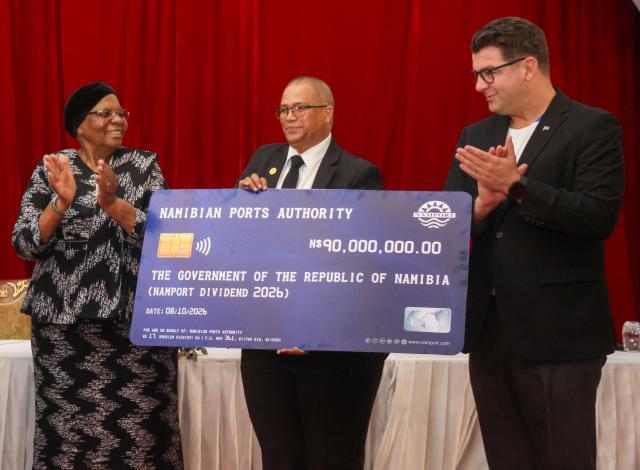 WINDHOEK, 08 October 2026 - from left to right President Netumbo Nandi-Ndaitwah, the vice president of the Namibia Football Association (NFA) is Jakobus Murs Markus, and Deputy Minister of Education, Innovation, Youth, Sport, Arts & Culture, Dino Balloti posing with a cheque sponsored by the Deputy Minister: Education, Innovation, Youth, Sport, Arts & Culture for 2026/27, 2027/28 and 2028/29 football season. (Photo: Hesron Kapanga) NAMPA