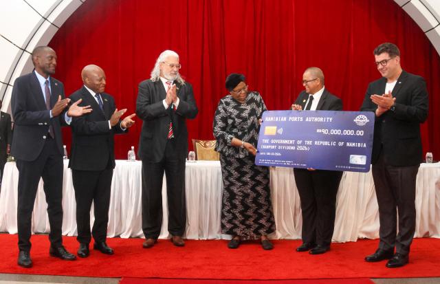 WINDHOEK, 08 October 2026 - from left to right Minister of Works and Transport Veikko Nekundi, Prime Minister, Elijah Ngurare, NamPort board chairperson Jerome Mouton, President Netumbo Nandi-Ndaitwah, the vice president of the Namibia Football Association (NFA) is Jakobus Murs Markus, and Deputy Minister of Education, Innovation, Youth, Sport, Arts & Culture, Dino Balloti posing with a cheque sponsored by the Deputy Minister: Education, Innovation, Youth, Sport, Arts & Culture for 2026/27, 2027/28 and 2028/29 football season. (Photo: Hesron Kapanga) NAMPA