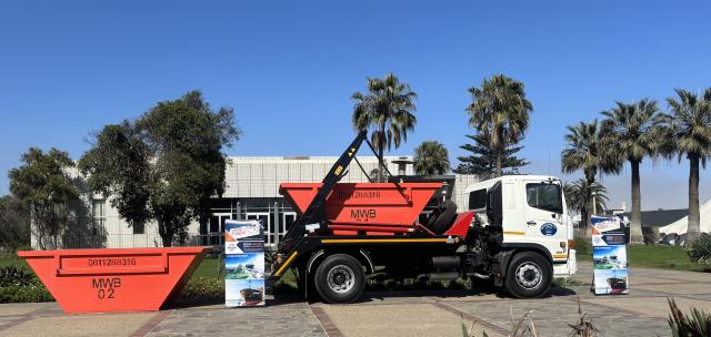WALVIS BAY, 15 October 2026 - The Hino 500 truck fitted with a 12-tonne skip loader and two of the 10 heavy-duty skips worth over N$ 2,7 million which were donated to the Walvis Bay Municipality by Namport, through its Social Investment Fund. (Photo by: Isabel Bento) NAMPA