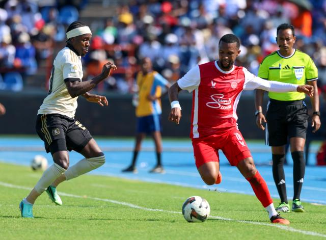 GABORONE, 17 October 2026 - African Stars player Willy Stephanus (in red) while  in action against Ghampani Lungu of Orlando Pirates during their Confederation of African Football (CAF), Champions League second round first priliminary game at the National Stadium of Botswana in Gaborone. Pirates won the match 1-0. (Photo by: Hesron Kapanga) NAMPA