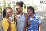 WINDHOEK, 28 November 2014 - Ivonne Lipenda (L), Mona Shilongo (M) and Martha Lucas, all born-frees, proudly show off their voting cards, ready to vote at the Roman Catholic Church in Wanaheda, Katutura. (Photo by: Joseph Nekaya) NAMPA