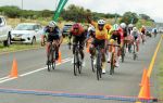 WINDHOEK, 31 January 2022 – Xavier Papo punches the air as he crosses the line to finish ahead of Daniel Abraham in second and Gerhard Mans in third place during the Windhoek Power Pedal Race along the Dordabis road. (Photo by: Maqonda Ndlovu) NAMPA