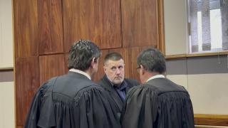 SWAKOPMUND, 23 August 2024 - Jandre Dippenaar pictured with his defence team after he was sentenced in the Swakopmund Magistrate's Court on Friday. (Photo by: Isabel Bento) NAMPA