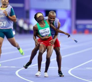 PARIS, 31 August 2024 – Paralympic sprinter Lahja Ishitile and her guide Sem Shimanda celebrating after winning a gold medal at the Paris 2024 Paralympic Games and setting a new Paralympic record in the women’s T11 400 metre race. Ishitile and Shimanda clocked 56.20 seconds to win gold at the Stade de Paris. (Photo by: Hesron Kapanga) NAMPA
