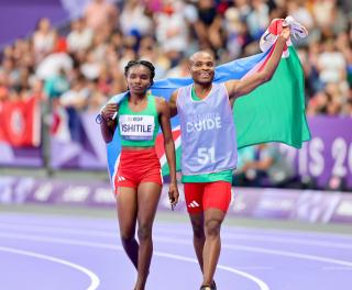 PARIS, 31 August 2024 – Paralympic sprinter Lahja Ishitile and her guide Sem Shimanda celebrating after winning a gold medal at the Paris 2024 Paralympic Games and setting a new Paralympic record in the women’s T11 400 metre race. Ishitile and Shimanda clocked 56.20 seconds to win gold at the Stade de Paris. (Photo by: Hesron Kapanga) NAMPA
