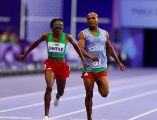 PARIS, 07 September 2024 – Paralympic sprinter Lahja Ishitile and her guide Sem Shimanda winning Namibia’s second medal at the Paris 2024 Paralympic Games after finishing third in the women’s T11 200 metre (m) race at the Stade de Paris. (Photo by: Hesron Kapanga) NAMPA