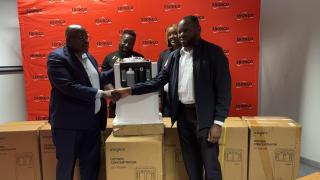 WALVIS BAY, 15 October 2024 - ErongoRED CEO Immanuel !Hanabeb handing over a donation of seven oxygen concentrators to the Erongo Region Chief Medical Officer Dr Leonard Kabongo. The machines will be distributed to the Walvis Bay, Swakopmund, Usakos, Karibib and Omaruru State Hospitals. (Photo by: Isabel Bento)NAMPA